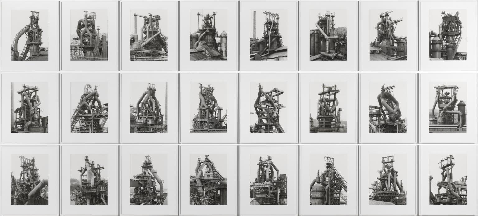 Bernd & Hilla Becher, Blast Furnaces, 1969–95 — 24 gelatin silver prints. Tate.